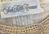 Saks Fifth Avenue tag inside the blouse