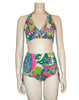 1960s women's bikini in a psychedelic lime green, aqua, lavender, and white print shown on a  mannequin form