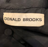 Donald Brooks tag. 