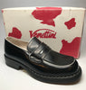 1990s black penny loafers with white trim and chunky soles in front of original pink and white shoe box