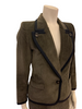 Olive-green, corduroy, two-piece skirt suit. Single-button jacket with wide lapels. Double-pleated skirt. 