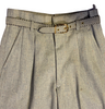 Closeup front view of 1950s grey pleat front trousers with a belt