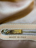 Engraved "Tod's" zipper-pull. 