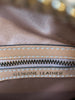 Interior white stitching and "Genuine Leather" stamp. 