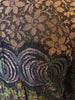 long-sleeve, tent-style, knee-length dress with a combination of lace & leopard-print jacquard in greens, brown and gold.