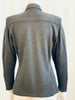 Back view of mannequin wearing a Claude Montana grey knit long sleeve shirt.