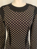 Close of  view of mannequin bust wearing long sleeve Moschino black and white polka dot Tunic/ Dress