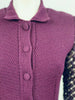 Close up front view of dark purple wool knit top with knit buttons and collar on Jean Paul Gaultier dress.