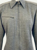 Close up of a Claude Montana grey knit collared zip-up shirt with horizontal zipper pocket at the chest. 