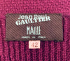Close up of Jean Paul Gaultier Maille tag in purple knit & crochet dress. 