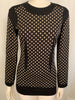 Front view of mannequin wearing long sleeve Moschino black and white polka dot Tunic/ Dress