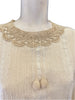 Close up of the lace high neckline & tie detail