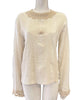 cotton gauze long sleeve blouse on a mannequin