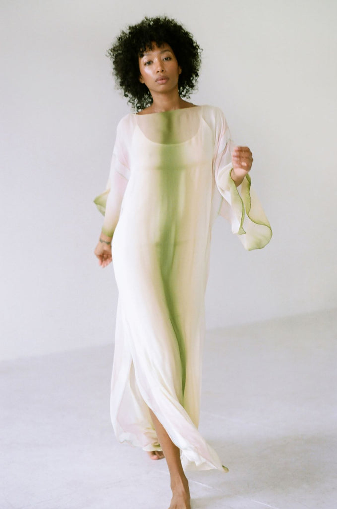 Woman in movement wearing a  hand dyed 1970's Halston Kaftan 