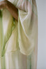 Woman's wrist bent accentuating the details on the sleeves of 1970's Halston Kaftan 