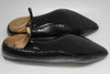 View of black leather soles and heel caps under shoes