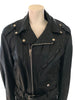 black leather motorcycle style jacket with zipper front and attached belt at waist. with three pockets on front.