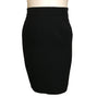 black two-piece suit with skirt. Jacket has faux fur, animal-print collar and double-breasted, pearlized buttons. Skirt is straight and knee-length.