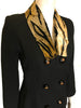 black two-piece suit with skirt. Jacket has faux fur, animal-print collar and double-breasted, pearlized buttons. Skirt is straight and knee-length.