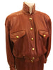 Front view on mannequin a two piece skirt and jacket in burgundy leather Jacket has gold studs on collar and front pockets. Skirt is straight and knee length. Jacket closes with six gold buttons