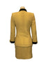 yellow, wool, two-piece jacket & skirt with black trim on four front pockets and on collar and cuffs. gold buttons down front.