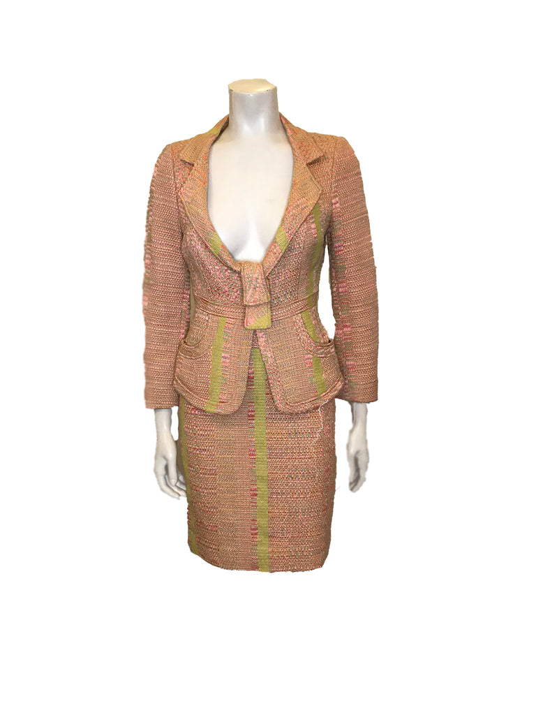 Full front view of mannequin wearing textured pink and green knit blazer and skirt set with abstract vertical stripes by Christian Lacroix. 