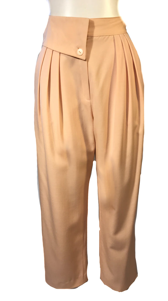 Front view of apricot colored womens trousers with a foldover waist band and front pleats