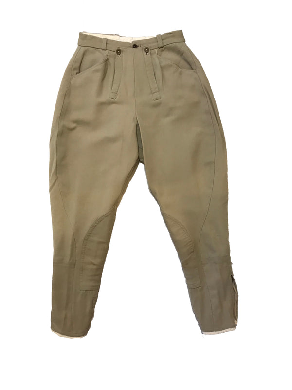 Stretchy, khaki jodhpurs with patches on the inner-knees. Three-button waistband closure. 