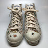 White high top sneakers with an all over bug print by Kiki Picasso x Slugger
