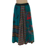 Front view of midi skirt with a mixed print featuring animal prints, animal shapes, and stripes in each panel framed by black piping. 
