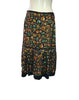Back view of Easton Pearson silk skirt with a green, orange, and brown gemstone print.