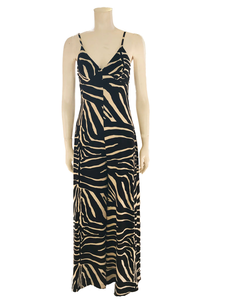 Black & white, zebra-print jumpsuit with spaghetti-straps, v-neck, and wide-legs. 