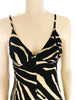 Black & white, zebra-print jumpsuit with spaghetti-straps, v-neck, and wide-legs. 