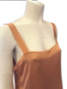 (Close up on vest) Sleeveless silk tunic top by Lanvin featuring a square neckline, boxy oversized fit, and a raw frayed hem. 