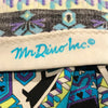Mr Dino Inc cursive signature in light blue printed on the hem of a tunic top