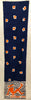 Courreges abstract oblong scarf with a woman lounging in front of waves