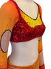 Top of consume set adorned with rhinestones over an orange to yellow gradient fabric and a red sequined bralette sewn on top 