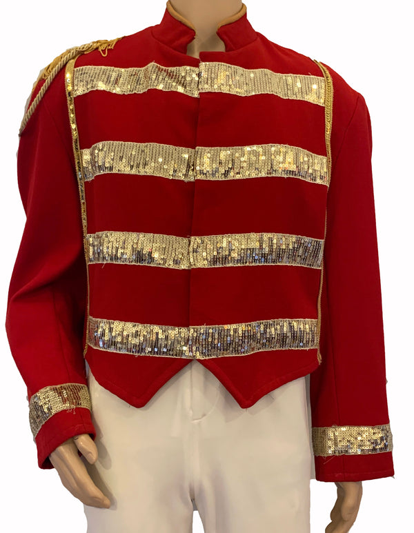 Red, band/military jacket with horizontal, gold-sequin stripes across the chest. Gold, fringe epaulette on right shoulder. 