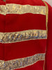 Red, band/military jacket with horizontal, gold-sequin stripes across the chest. Gold, fringe epaulette on right shoulder. 