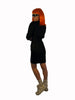 Black, long-sleeve, mini-dress with quilted panelling at the sides and collar. Asymmetrical front-zipper. 