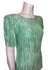 Zoomed in side view-Mary McFadden mint green pleated short sleeve