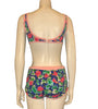 blue, pink, and green floral print bikini on a mannequin form