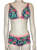 blue, pink, and green floral print bikini on a mannequin form