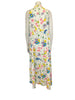 White and multicolor floral maxi dress with yellow belt.