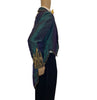 Teal tailcoat with lightning bolts in sequins, studs, and rhinestones on one shoulder & cuff.