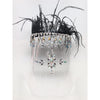 An embellished face shield with rhinestones and black feathers at the top