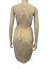 White, linen, sleeveless, knee-length, button-down dress with a triangular, cutout-back. 