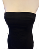 Black, strapless, form-fitting, evening dress with feather-trimmed hem. Knee length.