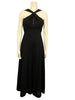 Black, wide-leg, cross-halter jumpsuit with slit in neckline.