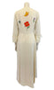 White maxi dress with colorful flower appliques